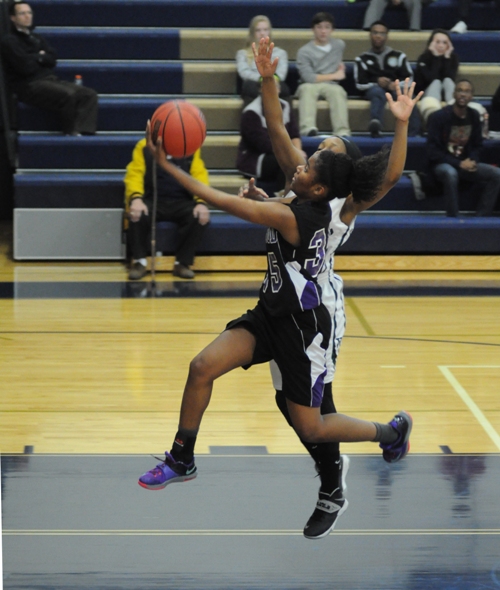 Nija Price flies in for a layup in the first period.